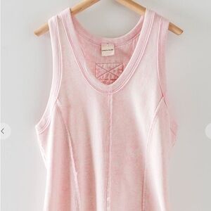 Light pink acid washed, racerback tank top with raw edges